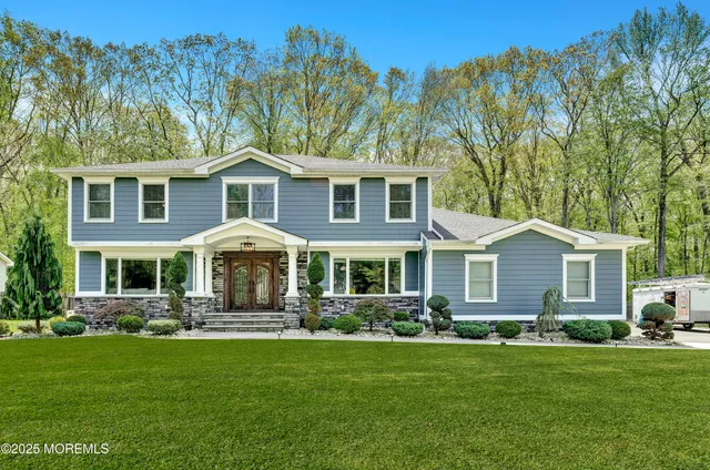 a front view of house with yard and green space