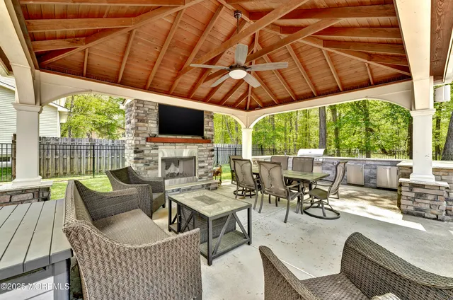 a building outdoor space with patio furniture and potted plants