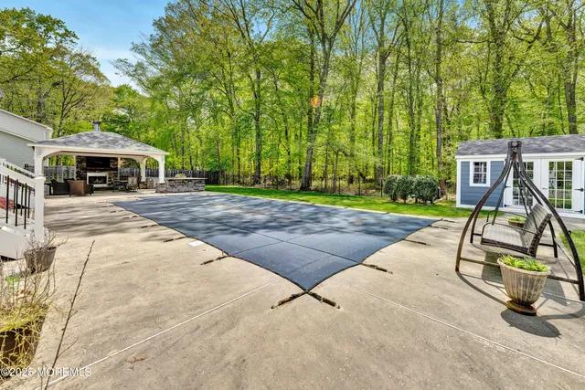 a view of a backyard with a patio