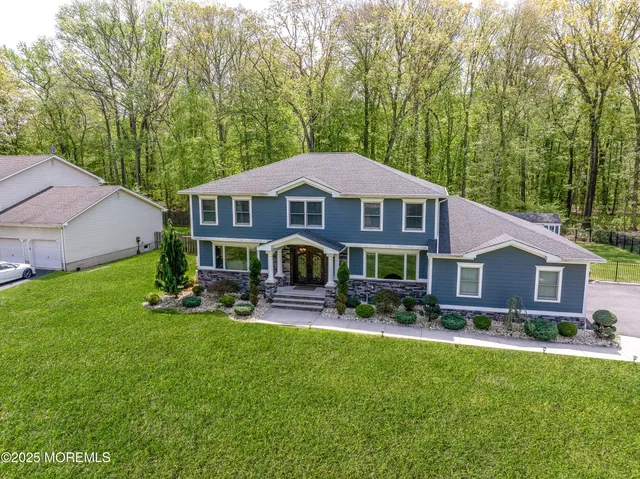 a view of a house with a yard porch and sitting area