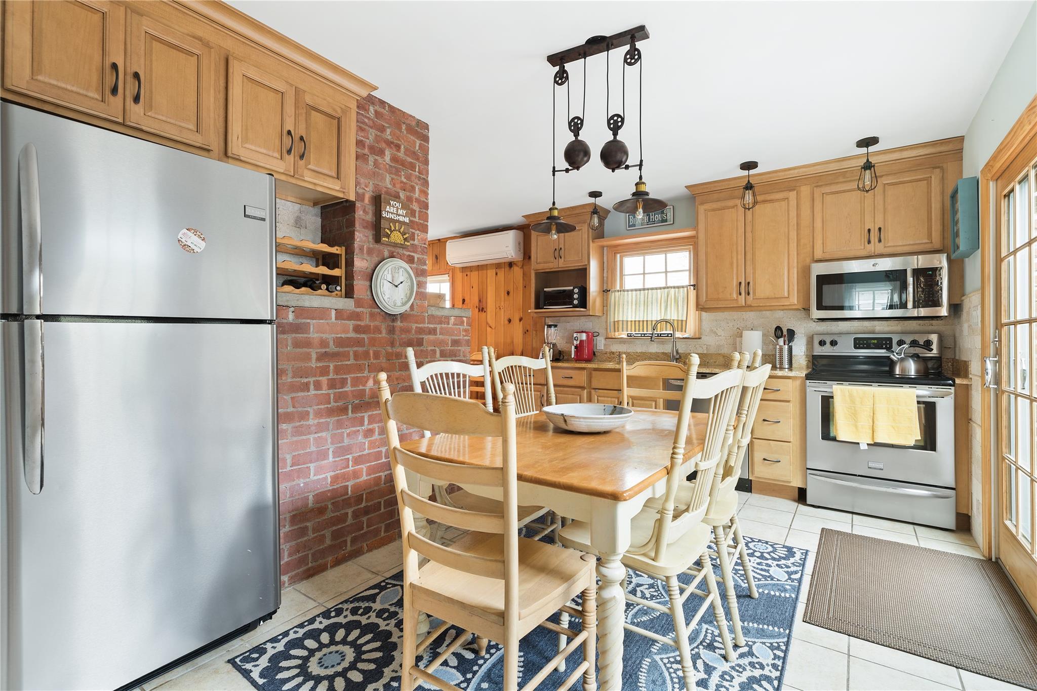 19 Ocean Road Ocean Beach, NY 11770 - Photo 2 of 20 a kitchen with stainless steel appliances a refrigerator and a stove top oven