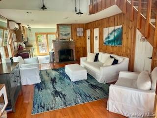 19 Ocean Road Ocean Beach, NY 11770 - Photo 5 of 20 a living room with furniture and a fireplace