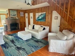 19 Ocean Road Ocean Beach, NY 11770 - Photo 7 of 20 a living room with furniture and a fireplace