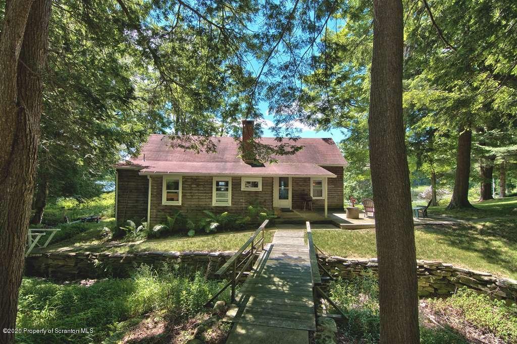 292 Loomis Lk Road Hop Bottom, PA 18824 - Photo 65 of 76 a front view of a house with garden