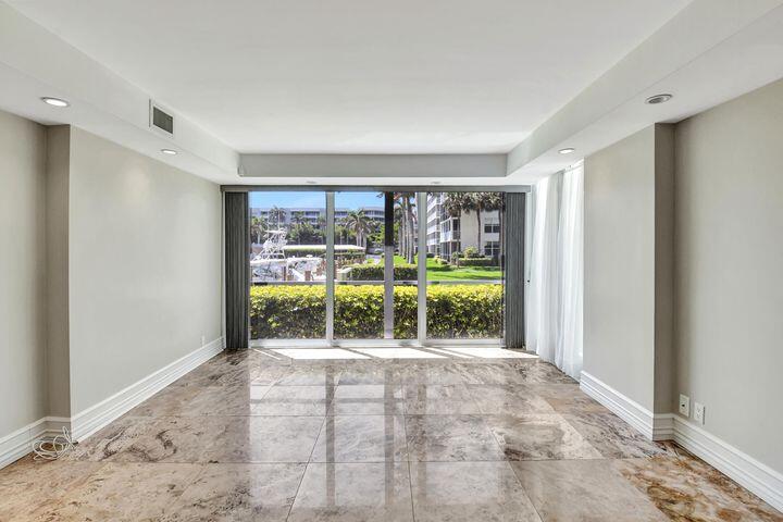 1 Harbourside Drive, Unit 4102 Delray Beach, FL 33483 - Photo 6 of 10 a view of an empty room with a window