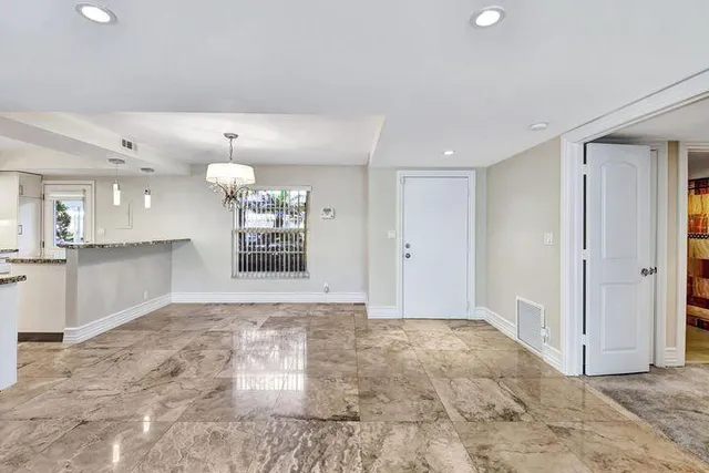 a view of an empty room and window