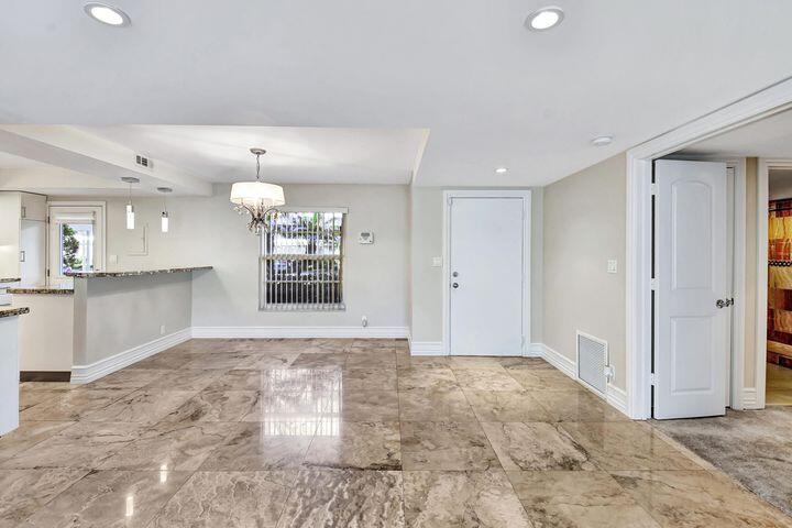 1 Harbourside Drive, Unit 4102 Delray Beach, FL 33483 - Photo 7 of 10 a view of an empty room and window