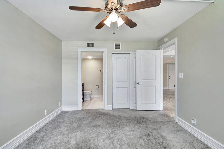 1 Harbourside Drive, Unit 4102 Delray Beach, FL 33483 - Photo 9 of 10 a view of an empty room and chandelier fan