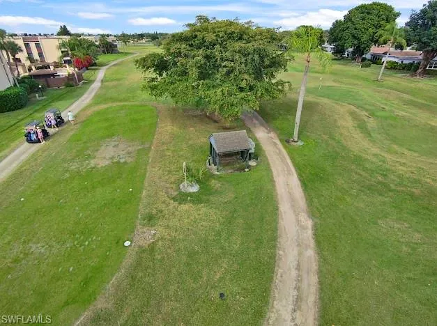 a view of a lake with a yard