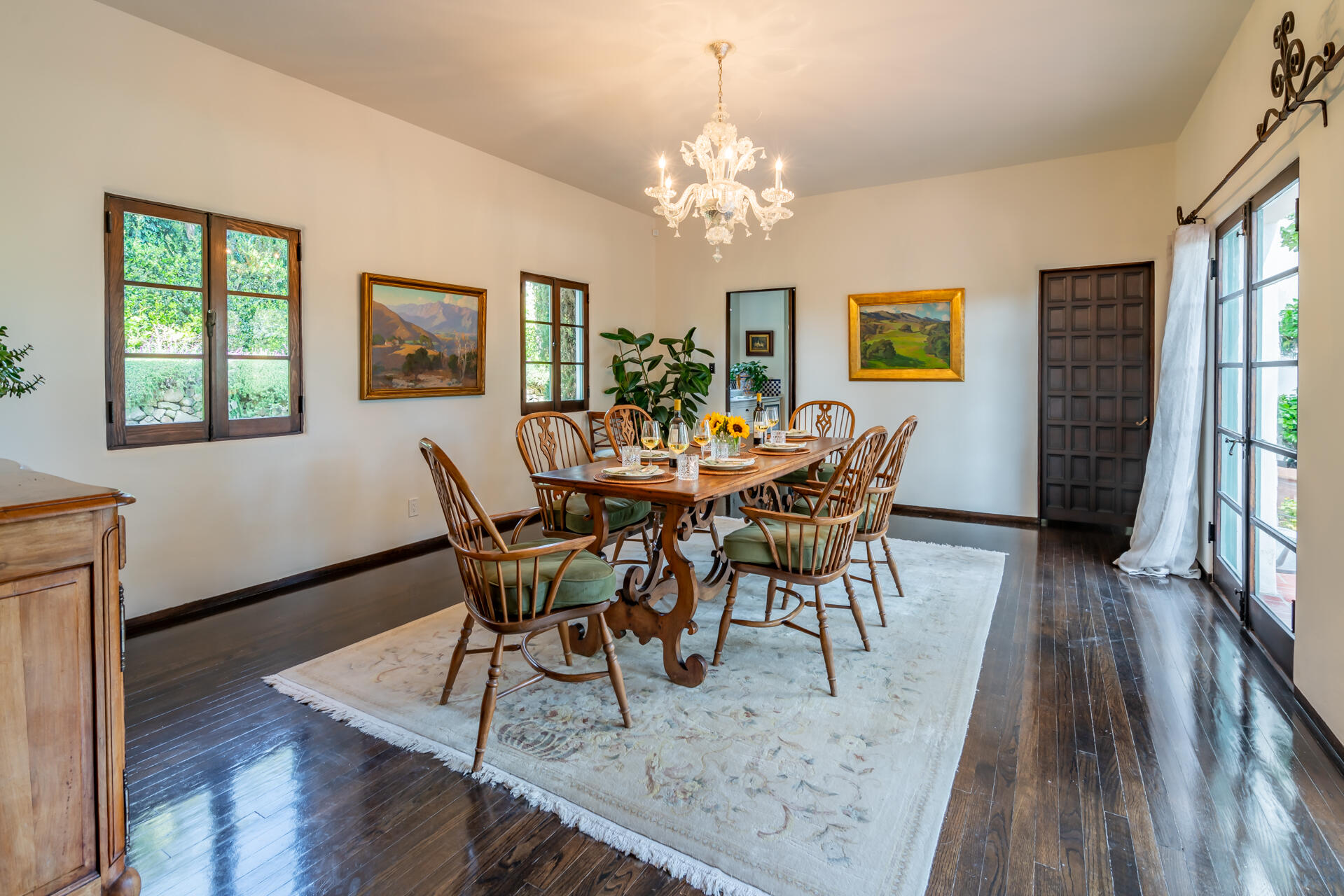 1098 Golf Road Montecito, CA 93108 - Photo 25 of 72 a view of a dining room with furniture a chandelier and wooden floor
