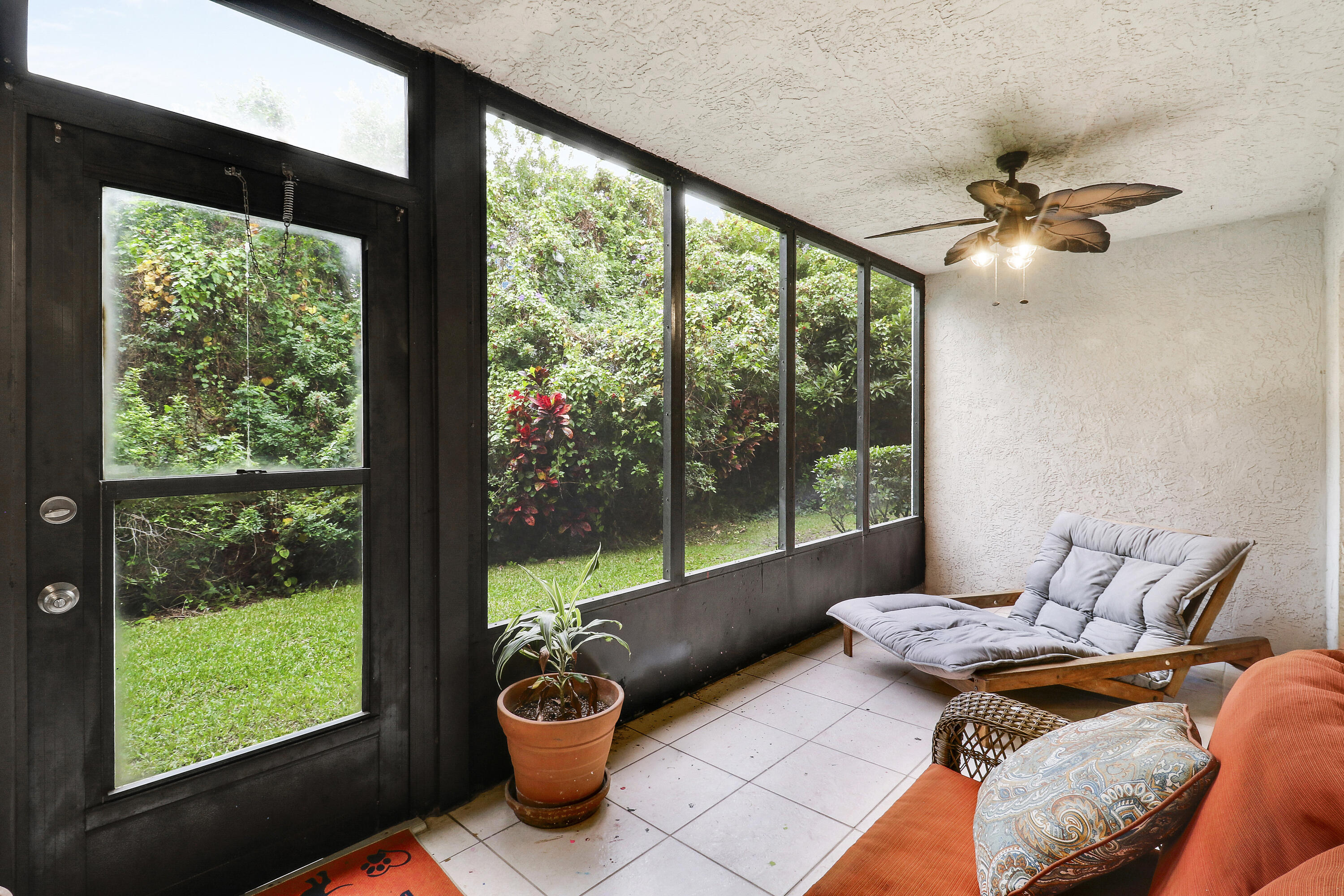 1200 Southeast Parkview Place, Unit F3 Stuart, FL 34994 - Photo 28 of 32 a bedroom with furniture and a floor to ceiling window