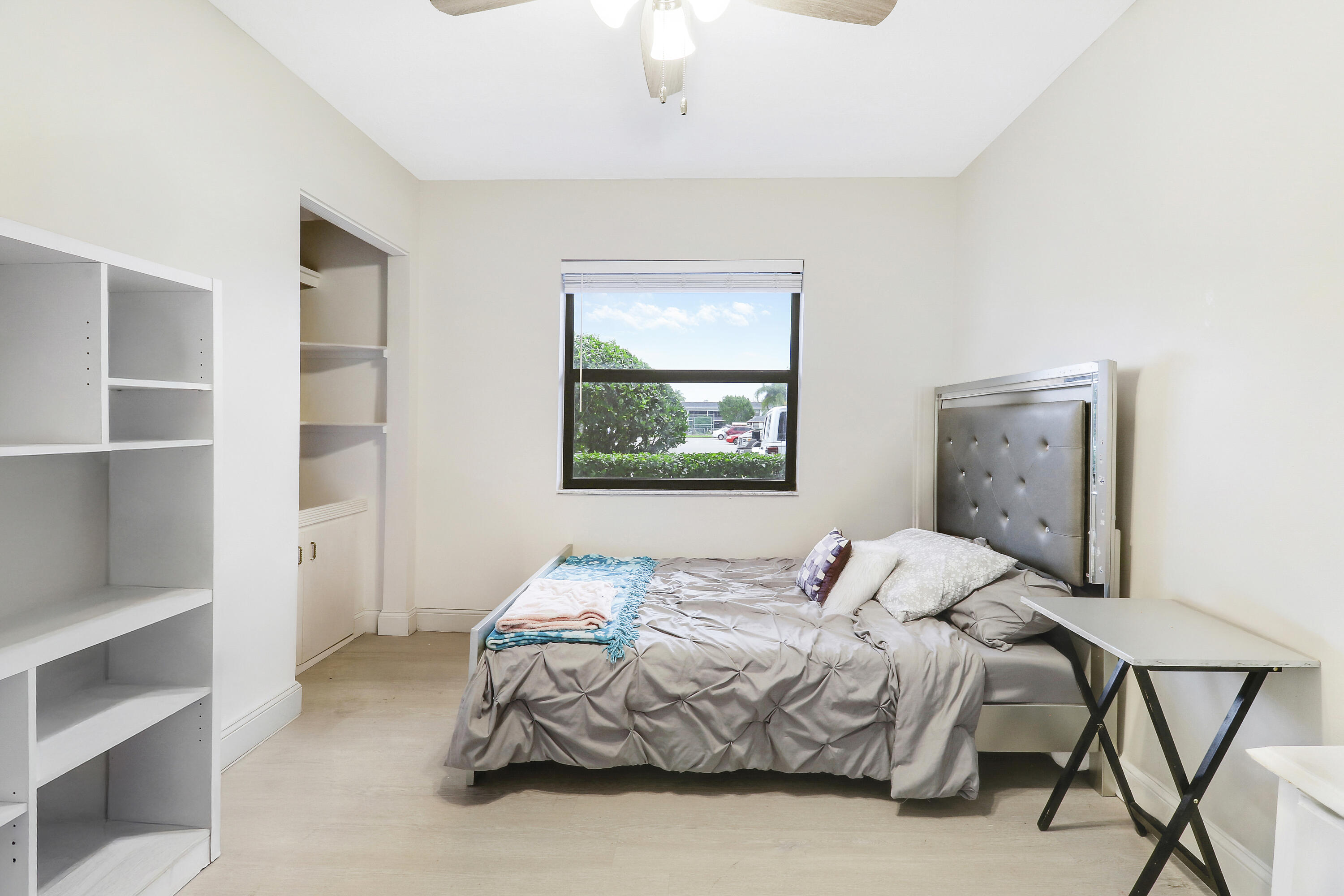 1200 Southeast Parkview Place, Unit F3 Stuart, FL 34994 - Photo 10 of 32 a bedroom with a bed and a window