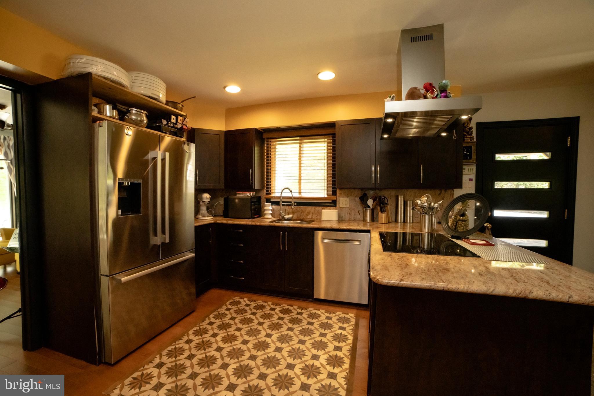2208 Oxeye Road Baltimore, MD 21209 - Photo 4 of 18 Stainless steel appliances with an induction stove