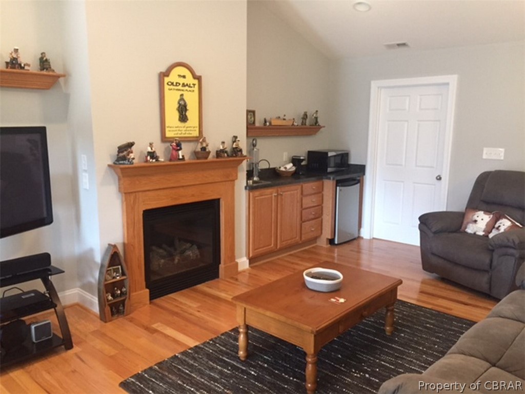 740 Marsh Pungo Road Locust Hill, VA 23092 - Photo 6 of 26 Den with gas fireplace and wet bar