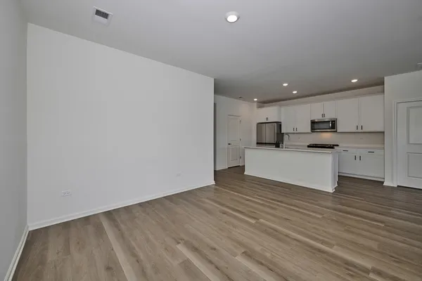 a view of kitchen with wooden floor