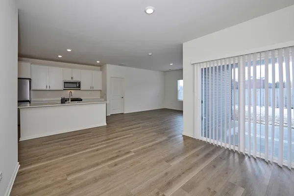 a view of kitchen with wooden floor