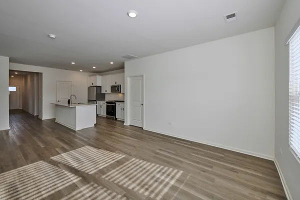 a view of kitchen and wooden floor