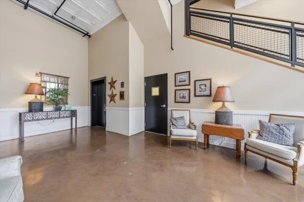 a view of a livingroom with furniture and windows