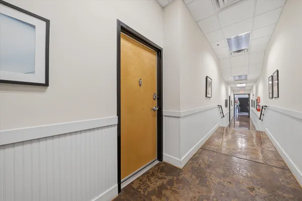 a very nice looking hallway with a large window