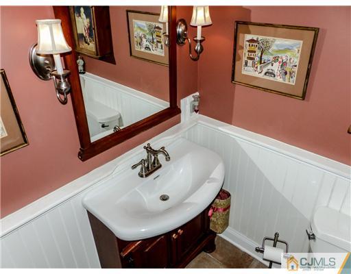 1614 Great Road Skillman, NJ 08558 - Photo 14 of 25 a bathroom with a sink and mirror with window