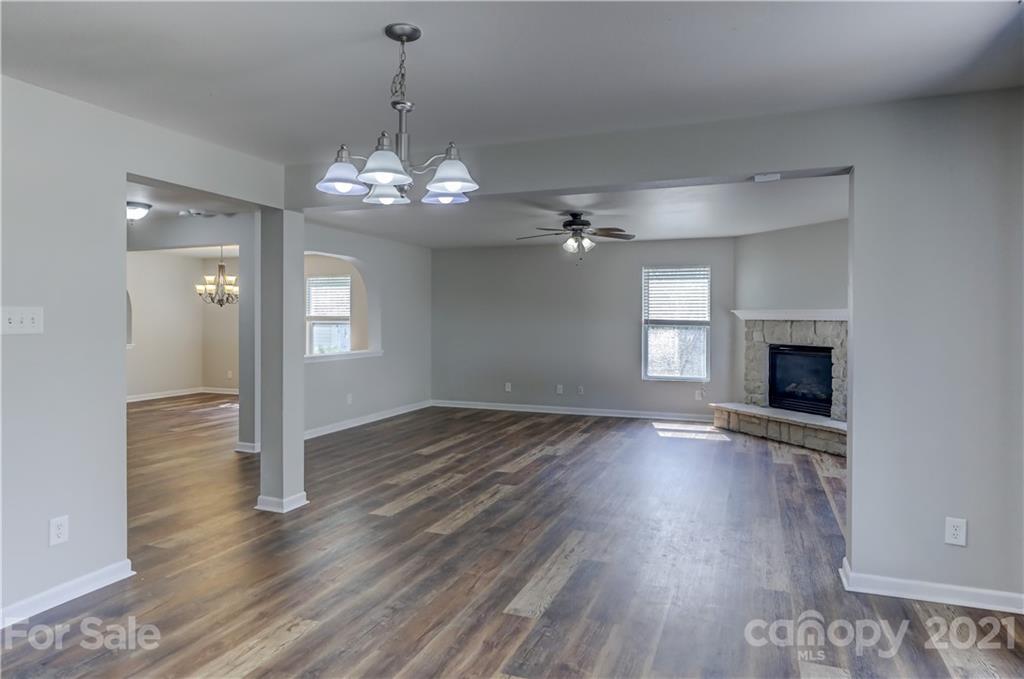 2170 Durand Road, Unit 40 Fort Mill, SC 29715 - Photo 22 of 48 a view of an empty room with wooden floor fireplace and a window