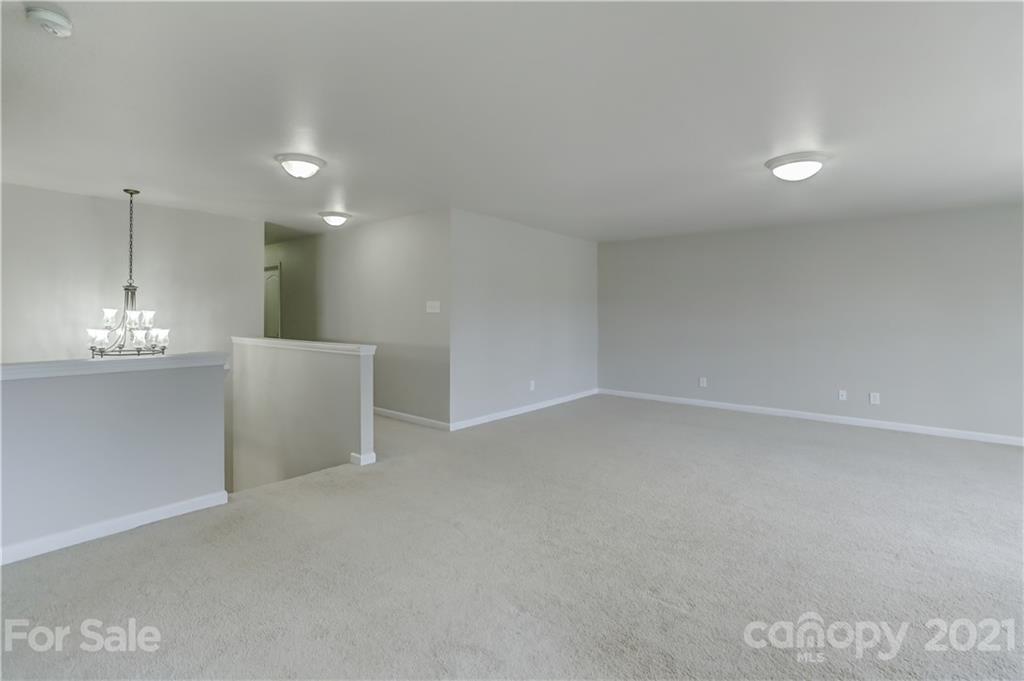 2170 Durand Road, Unit 40 Fort Mill, SC 29715 - Photo 40 of 48 a view of an empty room with a chandelier