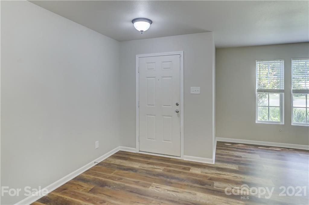 2170 Durand Road, Unit 40 Fort Mill, SC 29715 - Photo 5 of 48 an empty room with wooden floor and windows