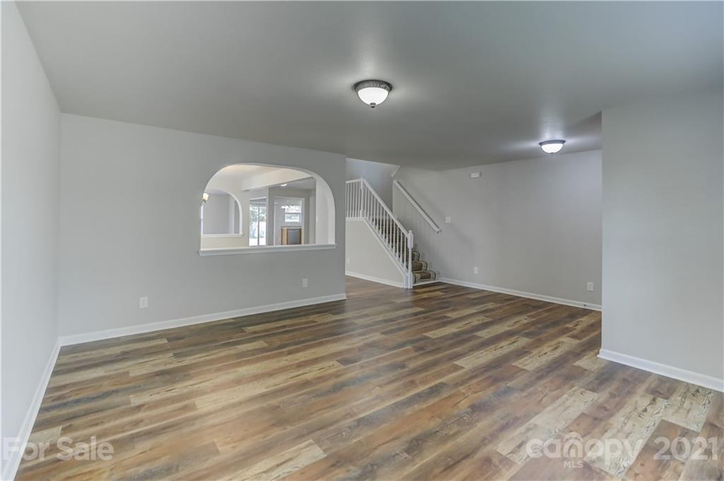 2170 Durand Road, Unit 40 Fort Mill, SC 29715 - Photo 8 of 48 a view of a livingroom with wooden floor and window