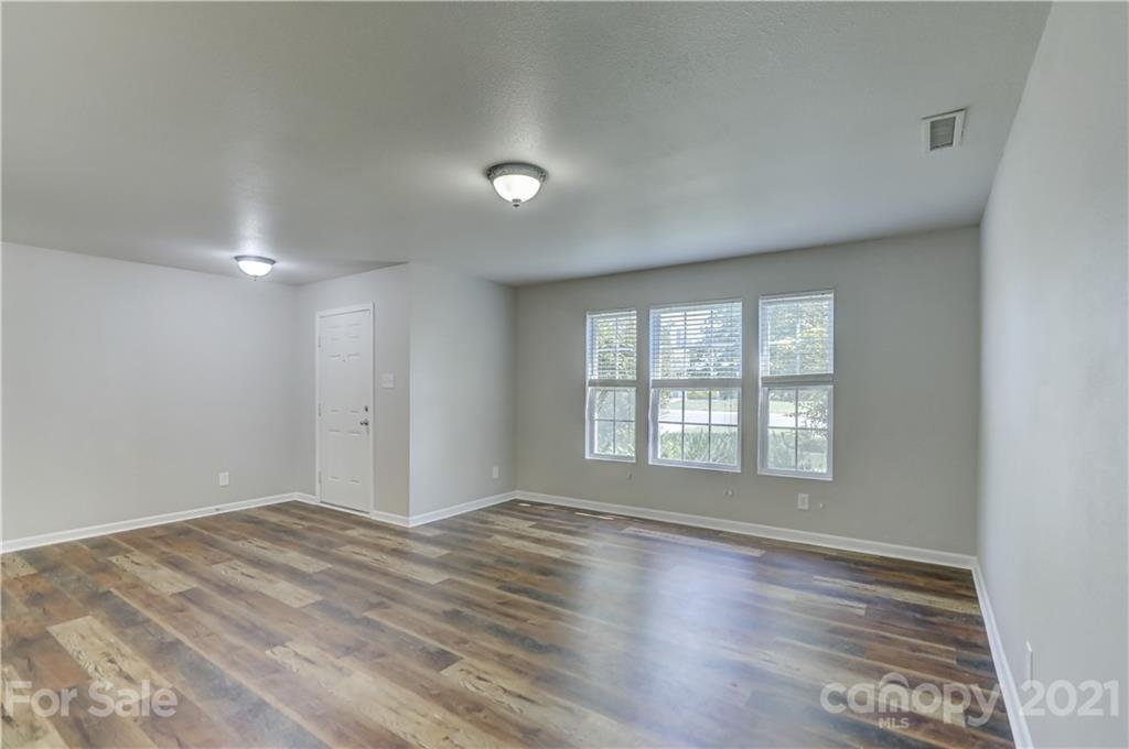 2170 Durand Road, Unit 40 Fort Mill, SC 29715 - Photo 9 of 48 a view of empty room with wooden floor and fan