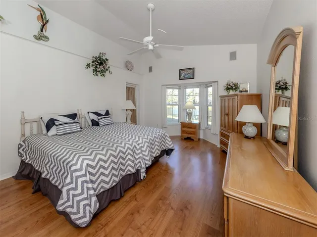 a bedroom with bed and window
