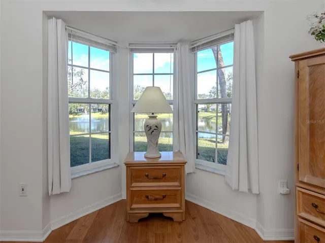 a room with a bed and a window