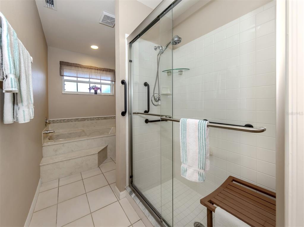 561 Clubside Circle, Unit 58 Venice, FL 34293 - Photo 15 of 44 a bathroom with a shower