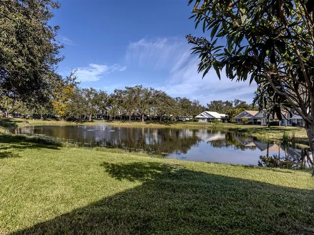 a view of lake with houses in the back