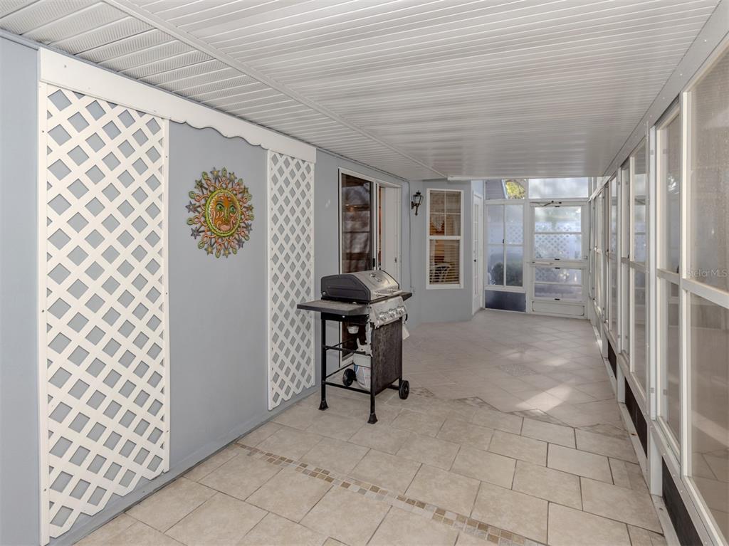 561 Clubside Circle, Unit 58 Venice, FL 34293 - Photo 26 of 44 a view of a hallway and chair in a room