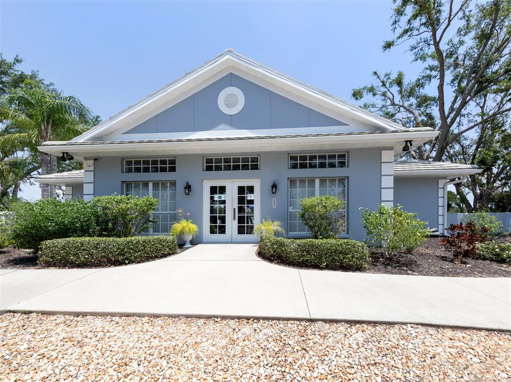 561 Clubside Circle, Unit 58 Venice, FL 34293 - Photo 28 of 44 a front view of a house with a yard