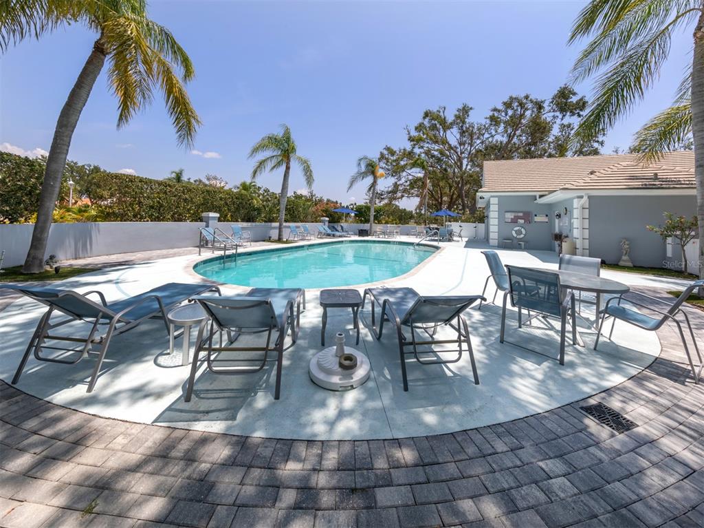 561 Clubside Circle, Unit 58 Venice, FL 34293 - Photo 30 of 44 a view of a swimming pool with outdoor seating