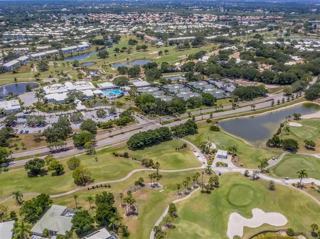 an aerial view of a residential houses with outdoor space
