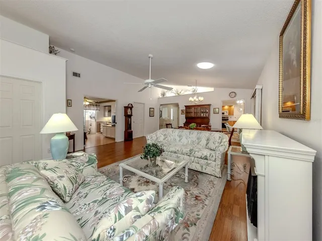 a bed room with furniture and a chandelier