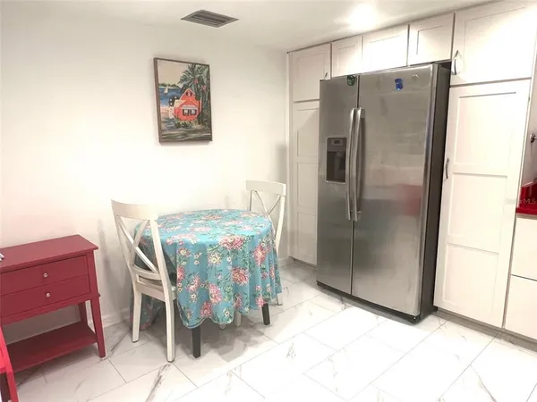 a bedroom with a bed and dresser