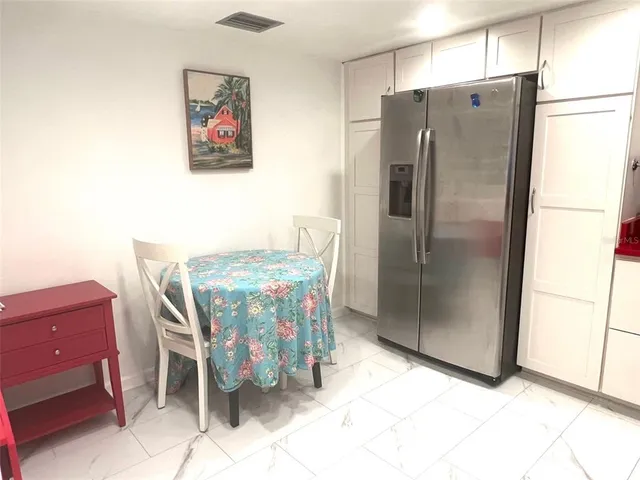 a bedroom with a bed and dresser