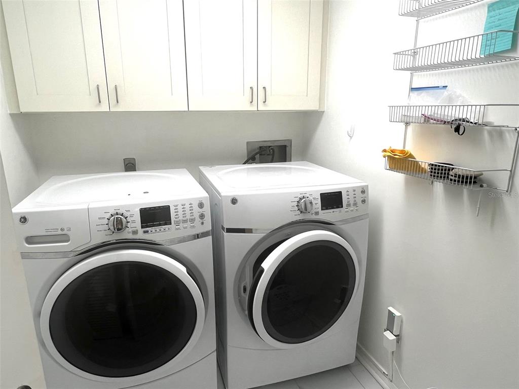 1000 Riverside Drive, Unit B104 Palmetto, FL 34221 - Photo 20 of 36 a utility room with dryer and washer