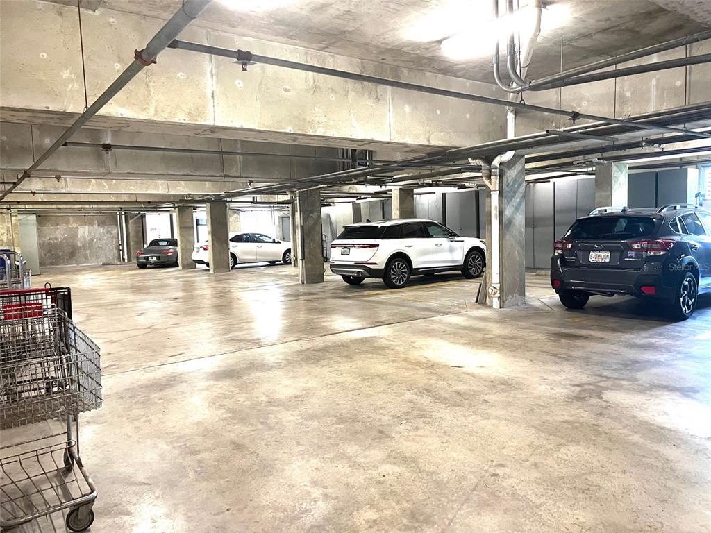 1000 Riverside Drive, Unit B104 Palmetto, FL 34221 - Photo 32 of 36 a view of parking garage with cars
