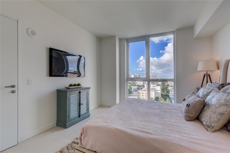 401 North Birch Road, Unit 1012 Fort Lauderdale, FL 33304 - Photo 11 of 44 a bedroom with a bed and a television
