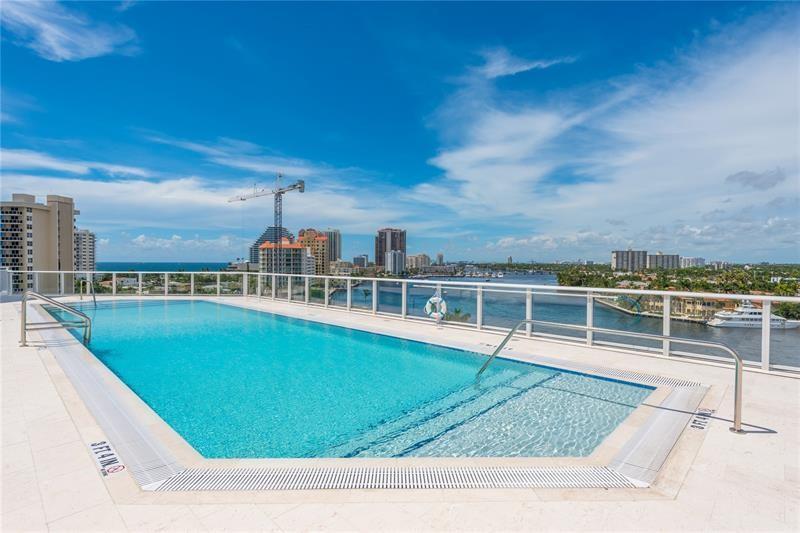 401 North Birch Road, Unit 1012 Fort Lauderdale, FL 33304 - Photo 25 of 44 a view of a swimming pool with a lake view