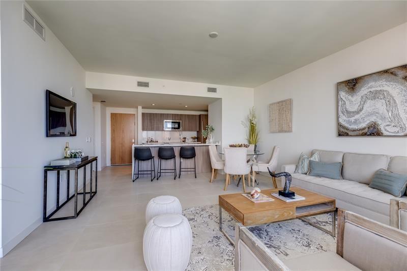 401 North Birch Road, Unit 1012 Fort Lauderdale, FL 33304 - Photo 7 of 44 a living room with furniture and a flat screen tv