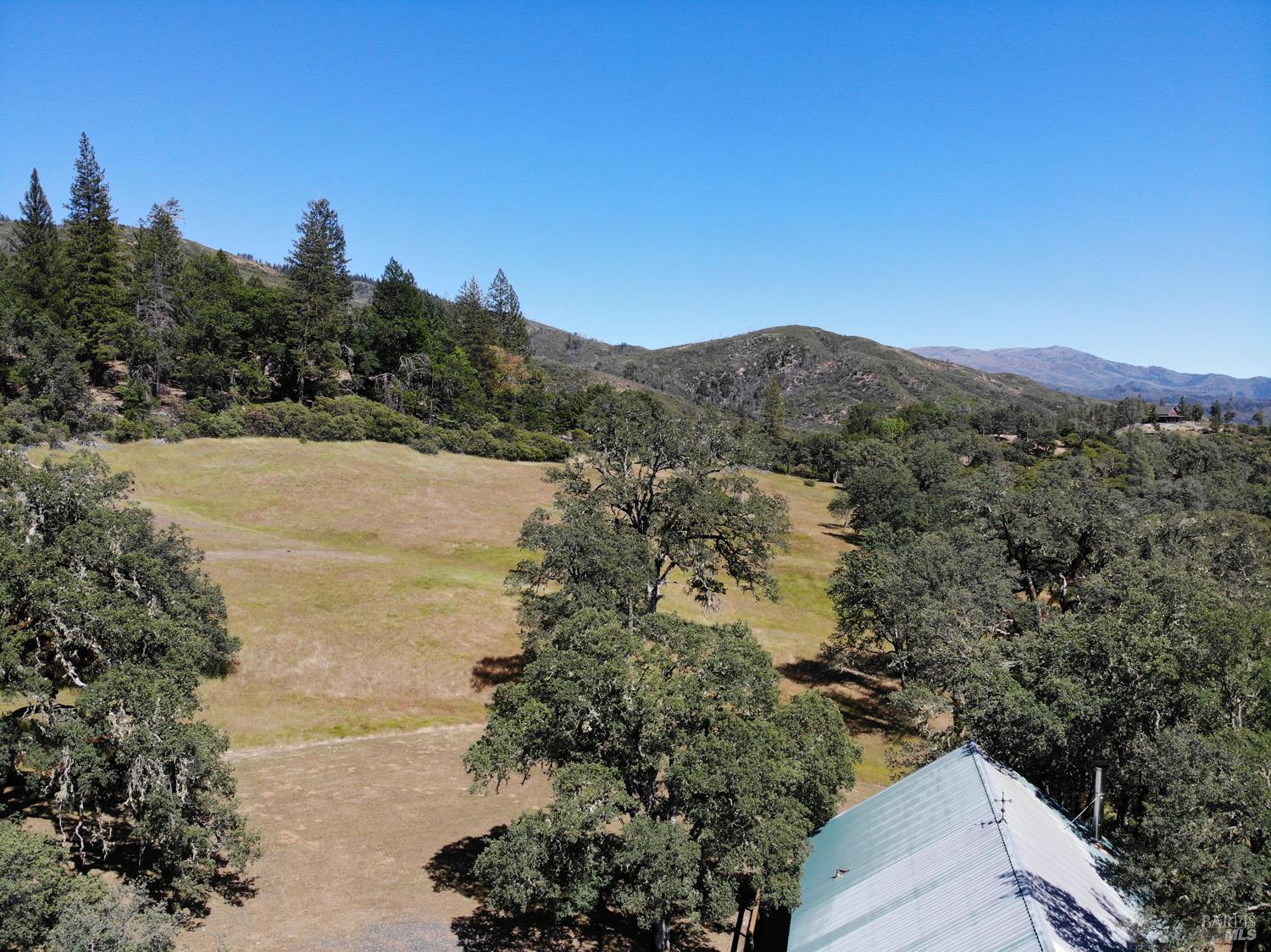 31312 High Point Road Potter Valley, CA 95469 - Photo 3 of 58 a view of lake with mountain