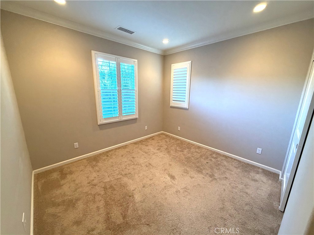 56 Strawberry Grove Irvine, CA 92620 - Photo 17 of 24 a view of an empty room with a window