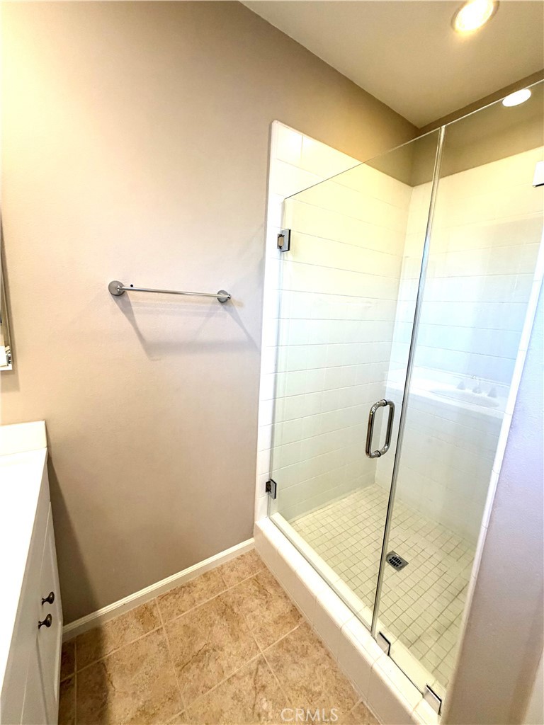 56 Strawberry Grove Irvine, CA 92620 - Photo 20 of 24 a bathroom with a shower