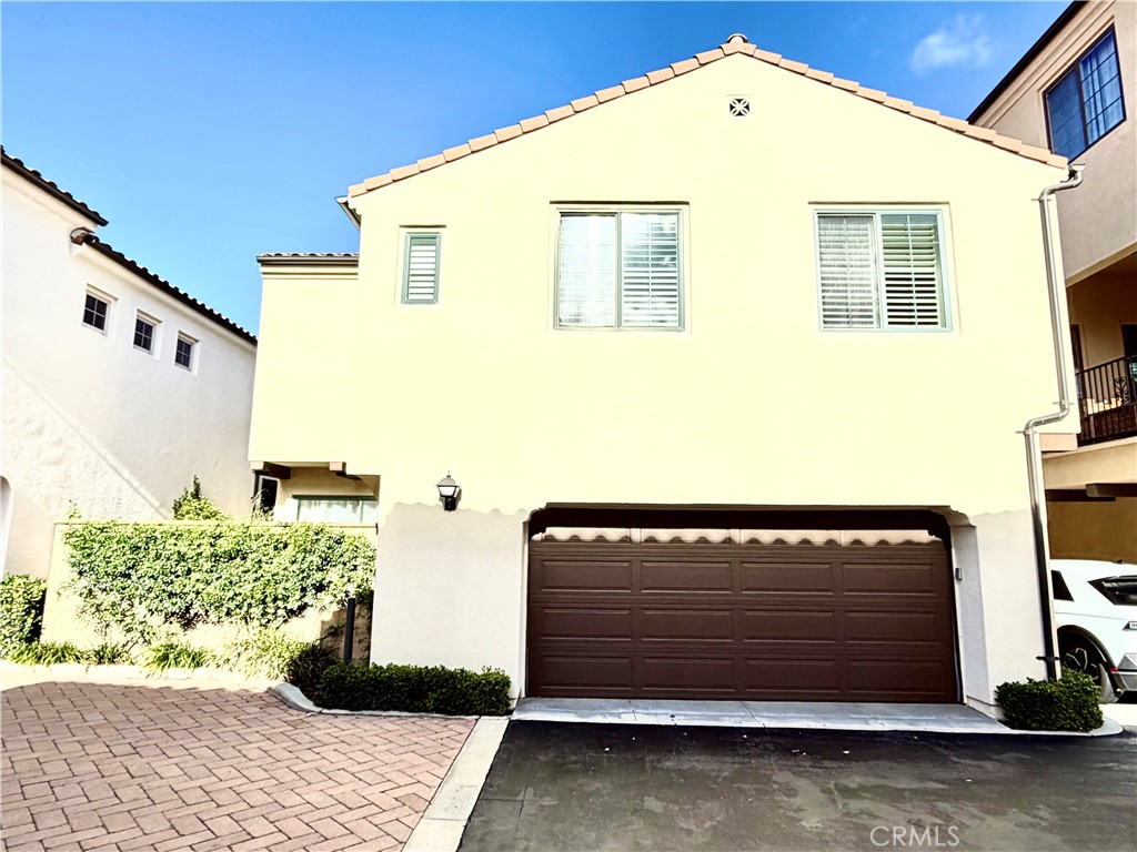 56 Strawberry Grove Irvine, CA 92620 - Photo 3 of 24 a front view of a house with a large window