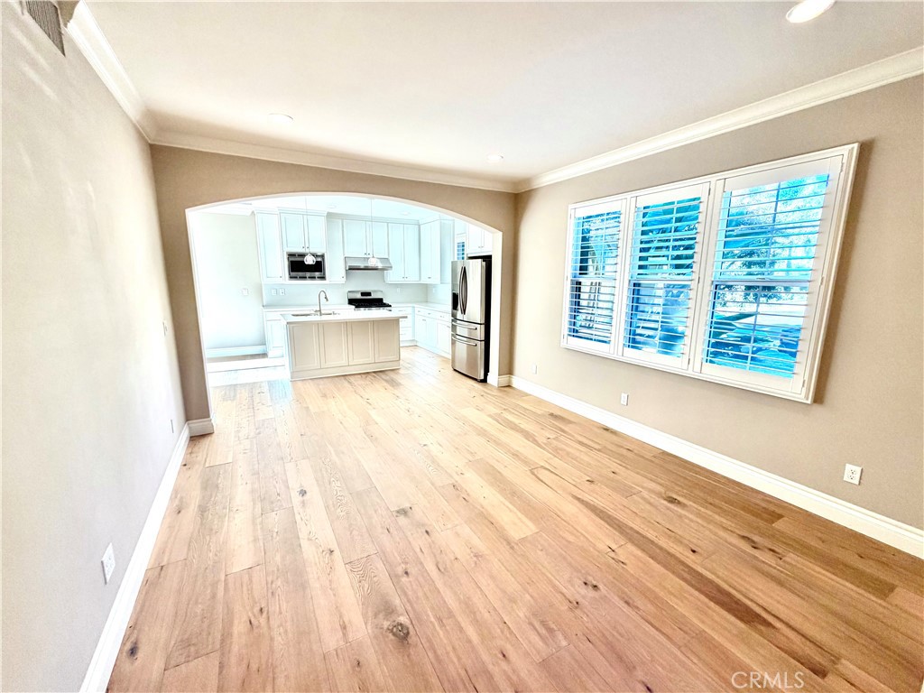 56 Strawberry Grove Irvine, CA 92620 - Photo 4 of 24 a view of a living room with a large window